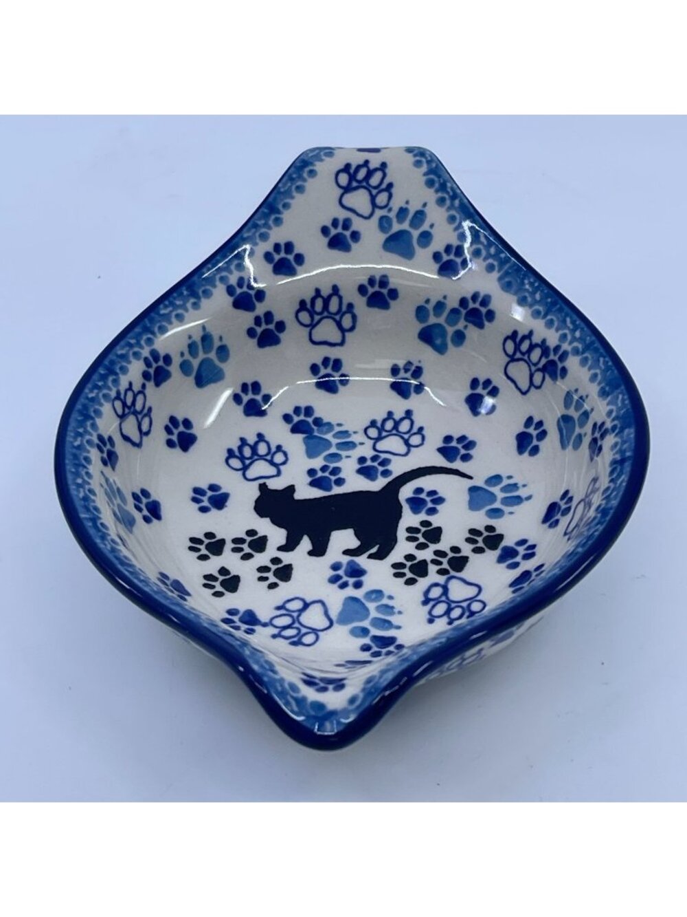 handmade polish pottery spouted and handled bowl boo boo kitty paws pattern